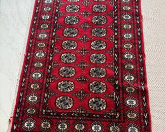 small woven rug -red