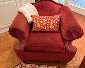 red fabric over-sized chair, nail head