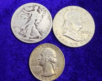 Three silver coins the Benjamin Franklin is very nice
