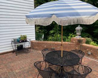 wrought iron table and 4 chairs $250, umbrella with stand $80