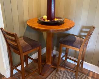 pub table and two chairs