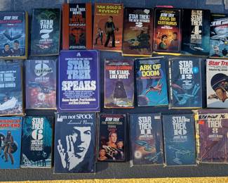 A collection of Science Fiction paperback novels mostly from the 60s and 70s with many of them being Star Trek, also have some Star Wars and Isaac Asimov. Have about 50 more books in hard and soft cover