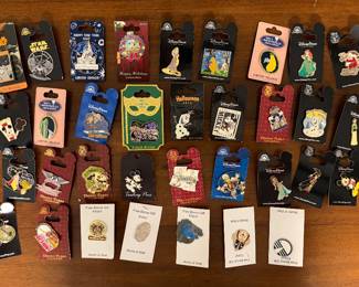 A collection of Disney Park exclusive pins. I have about 50 more pins plus postcards