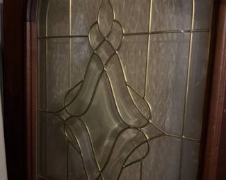 Decorative Arched with Glass Door Insert has brass-colored caming testured privacy