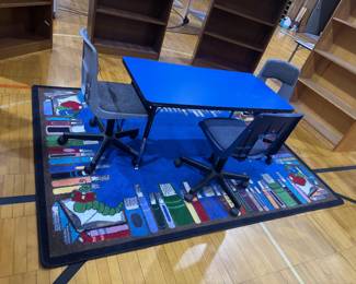 Library rug, blue table and fancy PADDED chairs on WHEELS