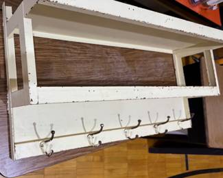 Metal utility room rack with hooks, pretty old!