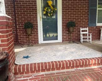 Brass containers on front porch