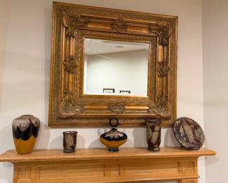 large ornate mirror and art glass