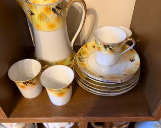 porcelain hot cocoa pot with cups and saucers, dessert plates