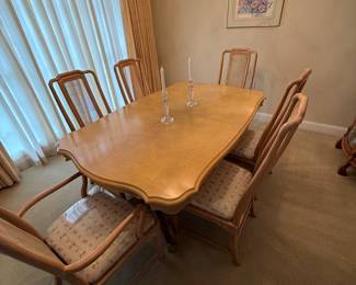 Table with 3 leafs chairs still have plastic on them