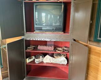 corner tv armoire painted brown with red interior