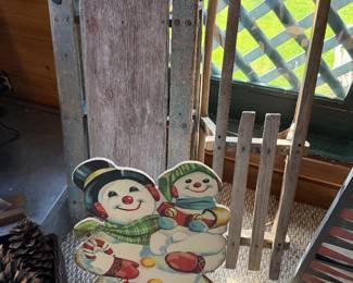 Antique sleds and snaowman decor