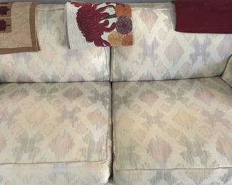 Lot 2: Patterned Two-Seat Sofa with Decorative Throws