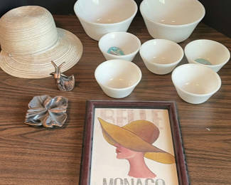 Lot 99: White Mixing Bowls, Framed Monaco Print, Hat, and Decorative Metal Pieces