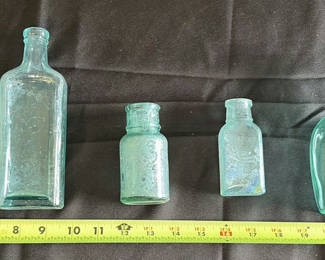 Lot 104: Collection of Five Aqua Glass Bottles