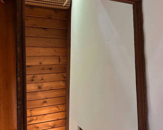 Lot 231: Wooden-framed wall mirror