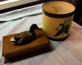Lot 279: Duck decoy on wooden display stand and hand-painted ceramic bird cylinder