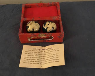 Lot 268: Red fabric box with two dark blue health balls