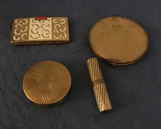 Lot 264: Gold-toned vintage makeup compacts and vanity case