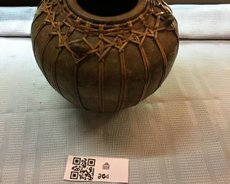 Lot 204: Round ceramic pot wrapped in woven rattan
