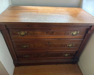 Lot 212: Four-drawer wooden dresser