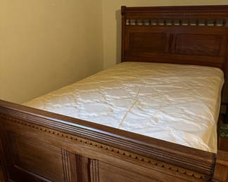 Lot 227: Ornate wooden bed frame with mattress