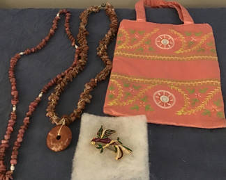 Lot 276: Beaded necklaces, parrot brooch, and embroidered bag