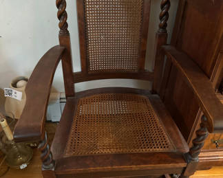 Lot 215: Antique Wooden Armchair with Caned Seat and Back