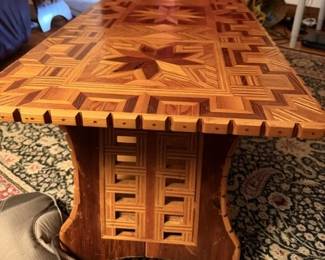 Tramp art coffee table - made in mid 1900s - there are two end tables and a China cabinet - prefer to sell as a set. See later pictures.  