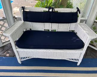 Excellent selection of wicker patio furniture includes this loveseat.