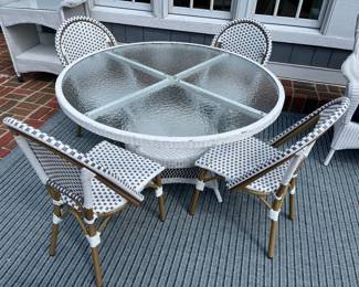 Circular wicker table and four Christopher Knight Home Elize outdoor chairs.