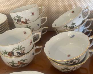 Closer view of the set of hand-painted Herend Rothschild Bird pattern dinnerware.
