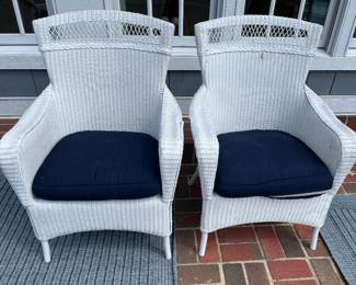 Pair of white wicker chairs, to be sold individually.