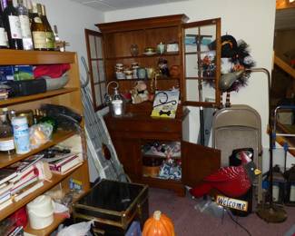 Basement with lots of assorted things including Hutch