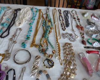Lots of costume jewelry and watches including Gucci, Michele & Rado