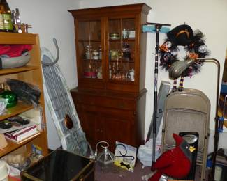 Basement with lots of assorted things including Hutch