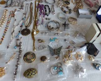 Lots of costume jewelry and watches including Gucci, Michele & Rado
