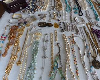 Lots of costume jewelry and watches including Gucci, Michele & Rado