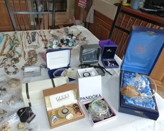 Lots of costume jewelry and watches including Gucci, Michele & Rado