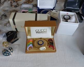 Lots of costume jewelry and watches including Gucci, Michele & Rado