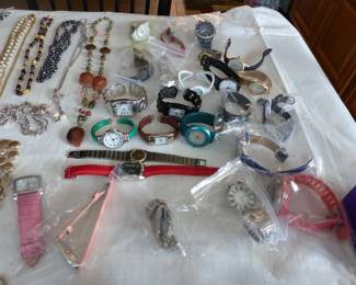 Lots of costume jewelry and watches including Gucci, Michele & Rado