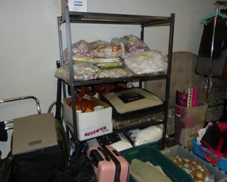 Basement with lots of assorted things including tablecloths