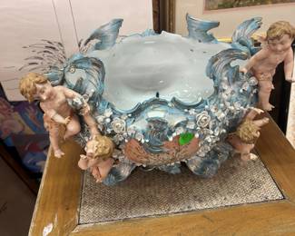 Planter adorned with cherubs