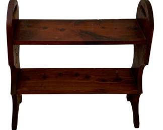 138 - Wood Shelf 24"x22"x7" (Description): A wooden shelf featuring two tiers with curved side supports and splayed feet. Measures 24 inches wide by 22 inches tall by 7 inches deep.