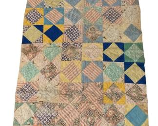 524 - Vtg Handmade Patchwork Baby Quilt 49"x32" (Description): Vintage handmade patchwork baby quilt featuring a square-in-square pattern in a delightful array of colorful cotton fabrics. The quilt showcases various printed and solid fabrics in shades of blue, yellow, pink, green, orange, and cream, arranged in a charming diamond block design. Hand-quilted throughout with visible stitching. Shows signs of age and use with some staining and wear consistent with a well-loved antique