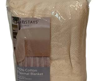 413 - Mainstays Cotton Thermal Blanket Queen/King (Description): Mainstays 100% cotton thermal blanket in parchment color. Queen/King size measuring 102 inches wide by 90 inches long. New in original packaging with machine washable care instructions.