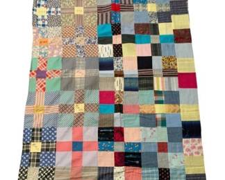 520 - Vtg Unfinished Patchwork Quilt Top Blanket (Description): Vintage unfinished patchwork quilt or blanket top featuring a colorful array of fabric squares in various patterns including plaids, florals, stripes, and solids. The scrappy design incorporates a wide range of colors from pastels to bold hues, characteristic of mid-century quilt making using repurposed fabrics. This piece remains unfinished and could be completed as desired. Measures 89 inches by 73 inches.