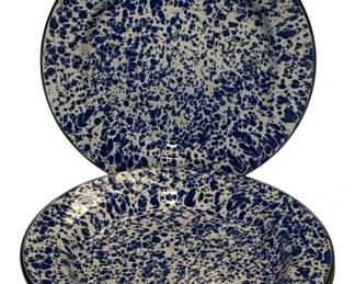 68 - 4 Blue & White Spatterware Enamel Plates (Description): Set of four enamelware plates featuring a classic blue and white spatterware pattern. The plates have a dark rim edge and display the characteristic mottled splatter design typical of vintage-style graniteware. Each plate measures 10 inches in diameter.