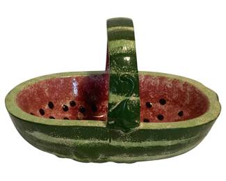 3 - Pottery Watermelon Basket 9"x14"x9" (Description): Charming pottery basket crafted in the form of a watermelon. Features a glossy glaze with realistic coloring including a green rind exterior, pink-red interior flesh, and black painted seeds. Measures 9 inches by 14 inches by 9 inches.