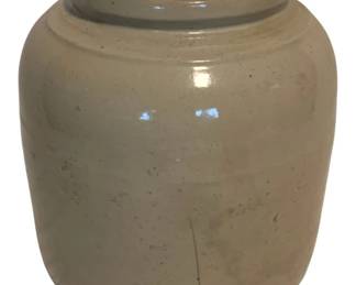 17 - Vtg Cream Glazed Stoneware Crock 8"x7" (Description): Vintage stoneware crock featuring a cream-colored glaze with a rolled rim and classic barrel-shaped body. The piece shows characteristic age-related surface wear including minor crazing and scuff marks consistent with period use. Measures 8 inches tall by 7 inches in diameter.